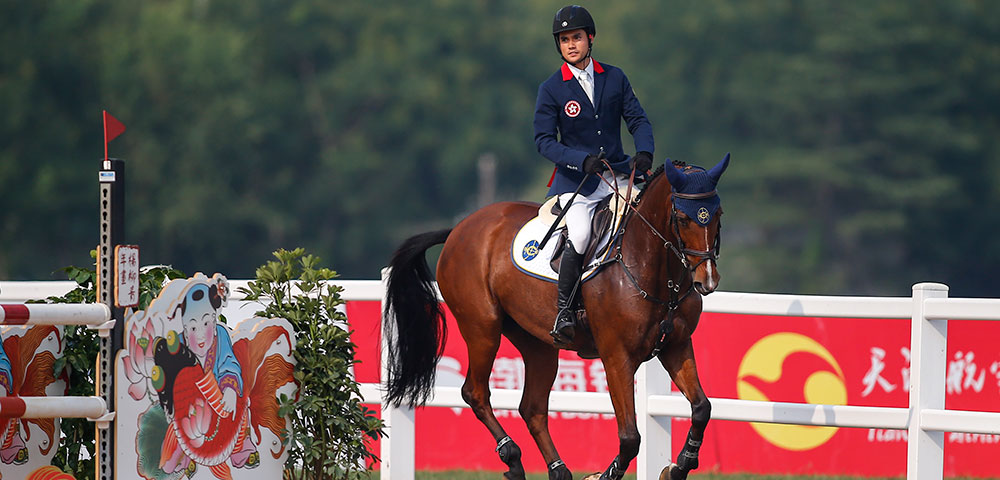 HKJC Equestrian Team rider Thomas Ho representing Hong Kong in an equestrian competition.