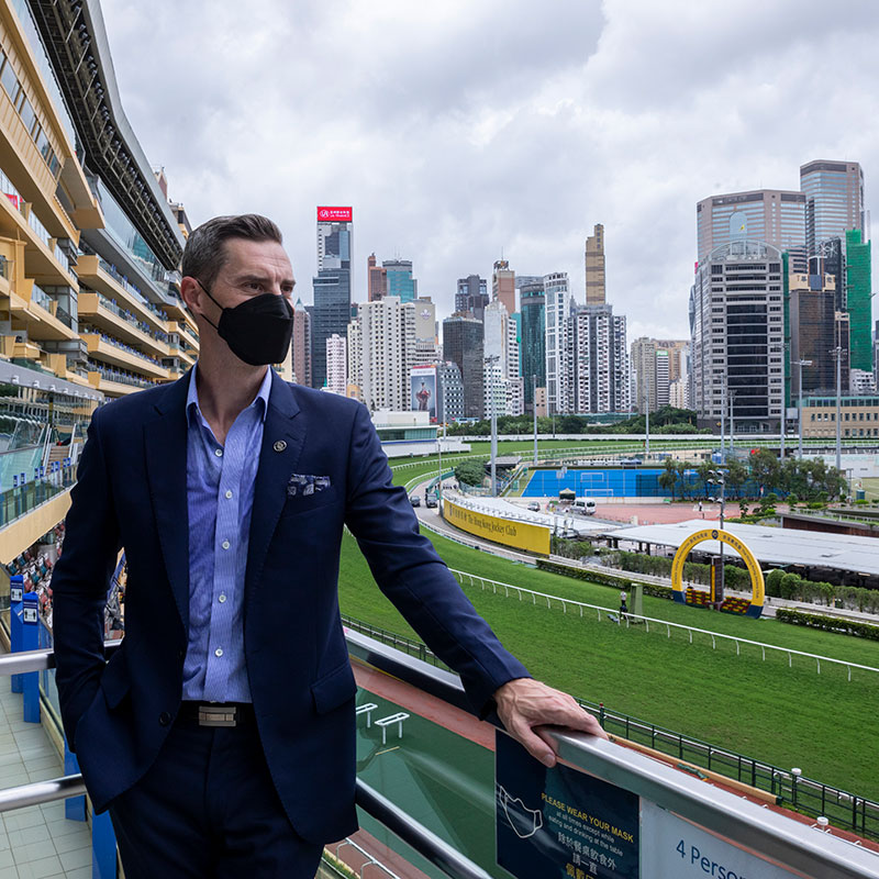 Andrew says Happy Valley Racecourse is a challenging track for jockeys. He highlights the tight, quick turn after the start, which demands great skill from jockeys to negotiate.